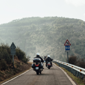 Motorcycle rider maintaining safe distance and driving defensively on a long journey