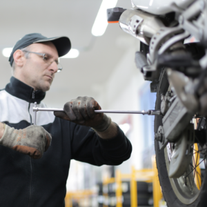 Pre-ride maintenance with checks on tire pressure, brakes, and chain tension for motorcycle trip